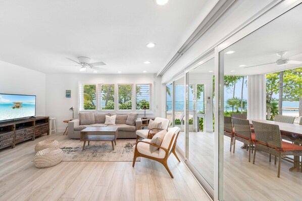 Living area with walkout access to the screened lanai. 