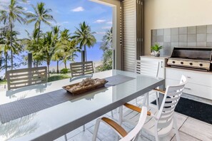 The private balcony features a six-seater table and gas BBQ to whip up meals while soaking up the sea breezes.