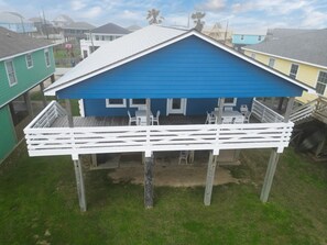 Partially covered deck with furniture to enjoy with your guests