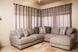 Snuggle up on the beautiful large sectional while enjoying a movie on the Smart Roku TV!