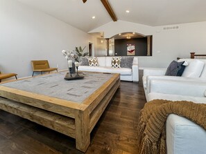 Gather round the gigantic coffee table in the main living room for an evening of fun and making memories! 