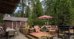 Private back porch with outdoor seating area and BBQ