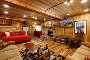 Downstairs living room with a daybed with trundle and a two queen sofa beds