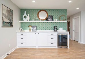 This bar area is a fantastic addition to the kitchen, making it easy to serve refreshments during gatherings.