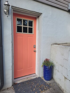 This the entrance to the downstairs apartment, next to the two parking spots. 