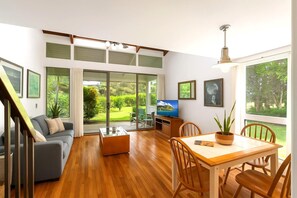 Slide open the doors to a storybook garden view?this sun-soaked living room is your personal gateway to serenity KUL-E113