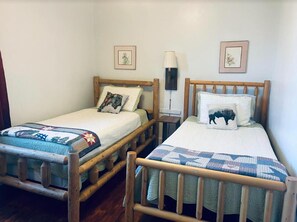 Bedroom 2 with 2 twin beds and lodgepole furniture