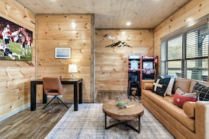 Enjoy movie marathons, karaoke battles & game nights in this entertainment hub