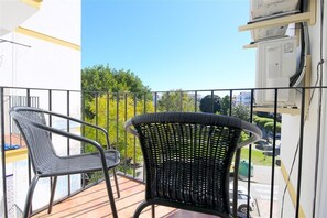 Balcony facing south-east with outdoor seating for two guests 