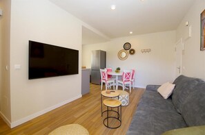 Modern lounge with comfortable seating and dining area to the rear