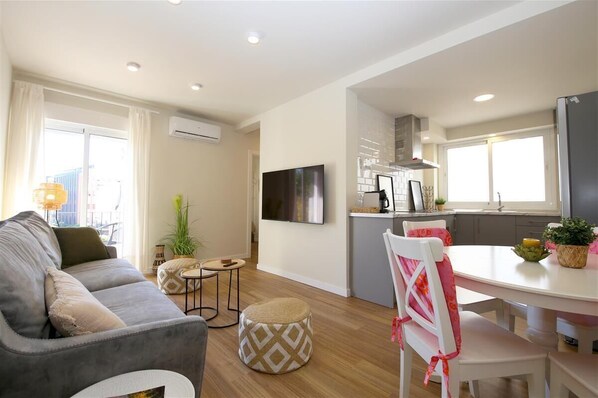Bright and modern lounge with A/C and access to the balcony
