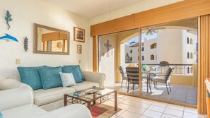 Step out from the living room onto the balcony.