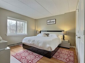 Unwind in luxury: Retreat to our spacious bedroom featuring a king-size bed, where comfort reigns supreme. From restful nights to lazy mornings, indulge in the ultimate relaxation in the heart of Killington.