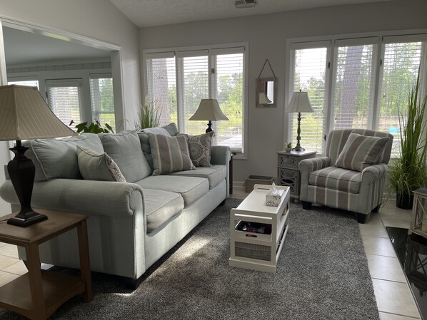 Open floor plan with large comfortable living space with extended patio with beautiful dockside/lake view across the  back of the home.