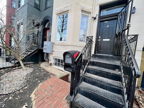 The beautiful neighborhood. Rows of historic row houses with lined ginko trees and sidewalks. This home boasts pride in ownership. Photo of view from outside the door.