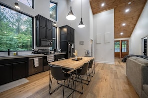 Dining table with pendant lighting overhead