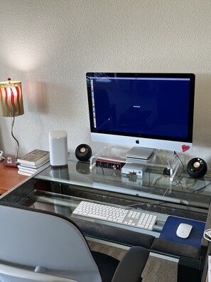 Desk space in corner of bedroom. Use of computer and printer is available.