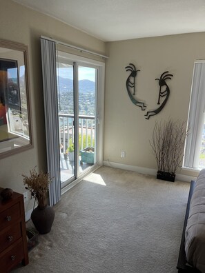 Bedroom with access to balcony.