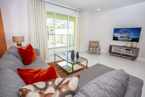 Living Room with 55" Smart TV#Disney #Parks #Clermont #Townhouse #Vacation #Rental #Orlando #Heatedpool