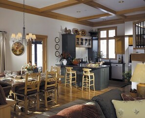 Eat in kitchen with bar and door to screened in porch