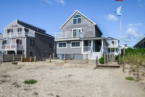 Wrap around deck stairs to the sandy front area and then the beach