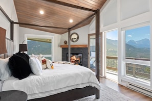 Master bedroom that contrasts intentional interior design with rugged outdoors