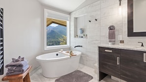 Master bedroom, featuring soaking tub with jaw-dropping views