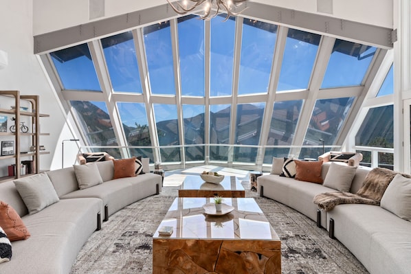 Expansive living room with panoramic views of the Rockies