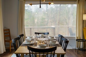 Expandable dining table to fit the whole family.Did you notice the view?