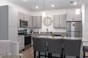 Large kitchen and island for cooking/eating