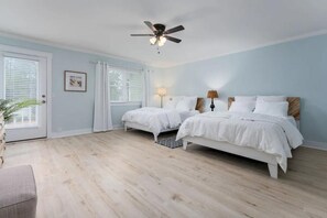 two queen beds with a roll away twin bed. 