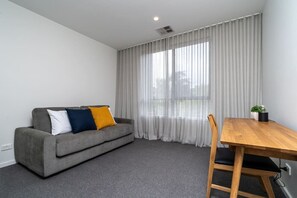 Study includes a chair and table and offers a comfortable sofa lounge that transforms into a double bed when pulled out, for additional guests. Professionally supplied linen and bedding are conveniently stored in the wardrobe.