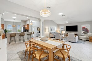 The kitchen has a dual coffee maker, toaster, blender, stand mixer, and crockpot