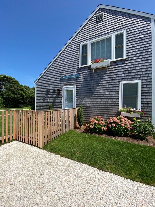 Entry way with fully fenced in yard