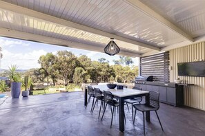 A stunning undercover entertaining area offers ample space for the whole group to dine alfresco.