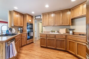 The fully equipped kitchen stands ready as a culinary sanctuary