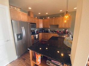 Kitchen W/granite counters and SS appliances. Some Board games.