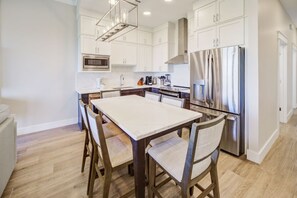 A neatly arranged dining area, perfect for intimate dinners or a small family gathering.