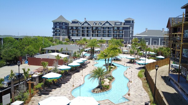 Resort complex featuring a central pool, ideal for guests seeking both activity and relaxation.