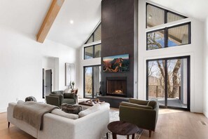 Floor to Ceiling Wood-Burning Fireplace and Windows