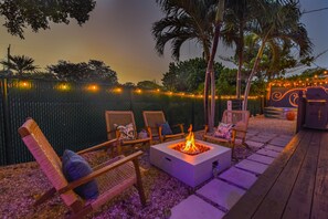 Cozy up under the evening stars by our perfectly set fireplace