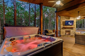 Unwind and take in the views in the private hot tub in the outdoor lounge area.