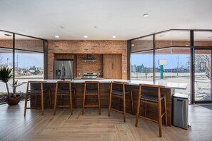 Well Equipped Kitchen w/Dishwasher and Microwave Built into Island.