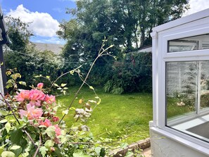 Enclosed rear garden, accessible via the conservatory with side gate to driveway.