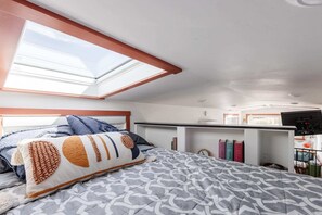 Enjoy a restful night on a comfortable queen-sized bed with soft, crisp linens. The plush mattress provides the perfect balance of support and comfort, ensuring you wake up feeling refreshed and ready to take on the day.
