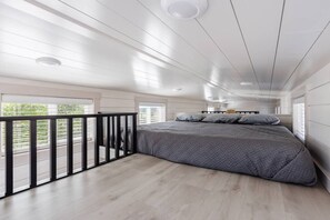 Enjoy a restful night on a comfortable King-sized bed with soft, crisp linens. The plush mattress provides the perfect balance of support and comfort, ensuring you wake up feeling refreshed and ready to take on the day.