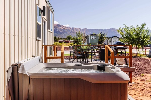 Unwind in the hot tub on the tiny home’s deck with beautiful mountain views. Soak in the warm, bubbling water while enjoying peaceful scenery, making it the perfect spot to relax after a long day under the open sky.