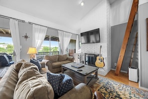 Bright and airy living area with foldout queen sofa