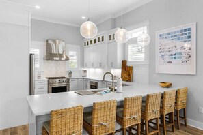 Well appointed kitchen with expansive kitchen island and seating for 6!