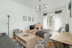 A cozy living room with soft lighting, stylish furniture, and decorative elements, creating a warm and inviting ambiance.

